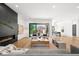Stylish living area featuring a modern fireplace, comfortable seating, and sliding glass doors to the backyard at 1241 S Garfield St, Denver, CO 80210