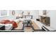 Open-concept living room featuring stylish furnishings and a neutral color palette at 1241 S Garfield St, Denver, CO 80210