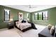 Stylish bedroom with large windows, modern decor, ceiling fan, and neutral color scheme at 1241 S Garfield St, Denver, CO 80210