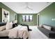Stylish bedroom featuring a large window, ceiling fan, neutral color scheme and modern décor at 1241 S Garfield St, Denver, CO 80210