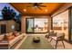 Inviting outdoor patio with comfortable seating, a fire pit, and seamless transition to indoor dining and living areas at 1241 S Garfield St, Denver, CO 80210