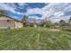 Spacious backyard showing a well-maintained lawn and outdoor amenities at 755 Braun St, Lakewood, CO 80401