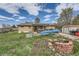 Backyard with a fire pit, canoe, and covered patio, great for entertaining at 755 Braun St, Lakewood, CO 80401