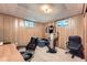 Basement featuring paneled walls, carpet, and an exercise area at 755 Braun St, Lakewood, CO 80401