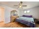 Bedroom featuring hardwood floors, a large dresser, and a bright window view at 755 Braun St, Lakewood, CO 80401