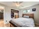 Bedroom with closet, wood-frame bed, wood floors and natural light at 755 Braun St, Lakewood, CO 80401