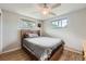Bedroom featuring a wood frame bed, wood floors, and natural light at 755 Braun St, Lakewood, CO 80401
