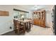 Bright dining area with wood floors, large window, and traditional wooden furniture at 755 Braun St, Lakewood, CO 80401