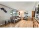Cozy living room with hardwood floors, comfortable seating, and natural light from a window at 755 Braun St, Lakewood, CO 80401