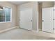 Bedroom with basement window, closet, and entry door at 1525 E 3Rd Ave, Longmont, CO 80501
