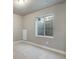 Carpeted basement room with an egress window providing natural light at 1525 E 3Rd Ave, Longmont, CO 80501