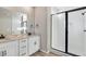 Modern bathroom with double vanity, granite countertops, and glass shower at 1525 E 3Rd Ave, Longmont, CO 80501