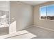 Bedroom with large windows, great light, and door at 1525 E 3Rd Ave, Longmont, CO 80501