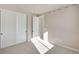 Bright bedroom with large closet, neutral walls, and plush carpeting at 1525 E 3Rd Ave, Longmont, CO 80501