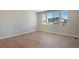 Spacious bedroom featuring wood flooring, neutral walls, and large windows offering great natural light at 1525 E 3Rd Ave, Longmont, CO 80501
