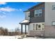 Modern two-story home featuring complementary siding colors and a brick foundation at 1525 E 3Rd Ave, Longmont, CO 80501