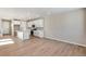 Open kitchen with white cabinets, granite countertops, stainless steel appliances, and modern finishes at 1525 E 3Rd Ave, Longmont, CO 80501