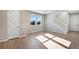 Bright living space featuring wood flooring, neutral walls, and a view of the staircase at 1525 E 3Rd Ave, Longmont, CO 80501