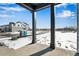 View from the front porch of a property under construction in a snow covered field at 1525 E 3Rd Ave, Longmont, CO 80501