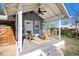 Cozy back porch with two rocking chairs and a small table to enjoy the outdoors at 4196 S Pennsylvania St, Englewood, CO 80113