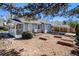 Backyard features a covered patio and raised garden beds, perfect for outdoor living at 4196 S Pennsylvania St, Englewood, CO 80113