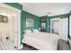 Spacious bedroom with en suite bathroom, closet and entry door at 4196 S Pennsylvania St, Englewood, CO 80113