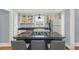 A kitchen features a gas range on island with granite counters and stylish cabinets with decorative storage at 4196 S Pennsylvania St, Englewood, CO 80113