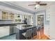 Updated kitchen features a gas range, granite countertops, and white cabinets with decorative wall storage at 4196 S Pennsylvania St, Englewood, CO 80113