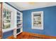 Bright office space with built-in shelves, natural light, and hardwood flooring at 4196 S Pennsylvania St, Englewood, CO 80113