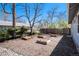 Landscaped yard with raised garden beds and mature trees adding privacy around the property at 4196 S Pennsylvania St, Englewood, CO 80113