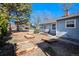 Landscaped yard with raised garden beds and a well-maintained lawn, offering curb appeal to the home at 4196 S Pennsylvania St, Englewood, CO 80113