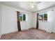 Bright bedroom with two windows and neutral carpets, awaiting your personal touch at 1049 Galena St, Aurora, CO 80010