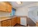 Classic kitchen featuring wood cabinets, laminate countertops, and a stainless steel sink at 1049 Galena St, Aurora, CO 80010