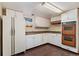 This Kitchen is equipped with a refrigerator and appliances at 1049 Galena St, Aurora, CO 80010