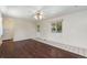 Bright living room featuring a ceiling fan and new flooring at 1049 Galena St, Aurora, CO 80010