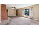 Inviting living room with a brick fireplace, neutral-toned walls, and natural light at 1049 Galena St, Aurora, CO 80010
