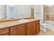 Bathroom featuring a vanity with cabinet space and a shower-tub combination at 2705 S Danube Way # 101, Aurora, CO 80013