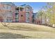 Well-manicured lawn of the building's exterior featuring brick and blue siding at 2705 S Danube Way # 101, Aurora, CO 80013