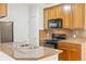Kitchen featuring granite countertops and stainless steel appliances at 2705 S Danube Way # 101, Aurora, CO 80013