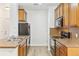 Spacious kitchen with stainless steel appliances and ample cabinet space at 2705 S Danube Way # 101, Aurora, CO 80013