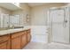 Bathroom with a shower, tub, and granite countertop at 10184 Park Meadows Dr # 1303, Lone Tree, CO 80124