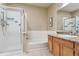 Bright bathroom featuring a shower, tub, and vanity with granite countertop at 10184 Park Meadows Dr # 1303, Lone Tree, CO 80124