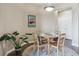 Dining area featuring hardwood floors, ample natural light, and decorative plant at 10184 Park Meadows Dr # 1303, Lone Tree, CO 80124