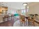 Open dining area next to kitchen and living room with hardwood floors at 10184 Park Meadows Dr # 1303, Lone Tree, CO 80124