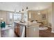Open kitchen featuring stainless steel appliances, granite countertops, and seamless views of the dining and living area at 10184 Park Meadows Dr # 1303, Lone Tree, CO 80124
