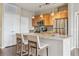 Modern kitchen with stainless steel appliances, island, and bar stool seating at 10184 Park Meadows Dr # 1303, Lone Tree, CO 80124