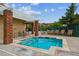 Relaxing hot tub beside the pool, surrounded by lounge chairs with community buildings and landscaping in the background at 10184 Park Meadows Dr # 1303, Lone Tree, CO 80124
