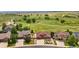 Bird's-eye view showcasing homes in a peaceful neighborhood, surrounded by open meadows and a tranquil environment at 1100 Columbine Way, Erie, CO 80516
