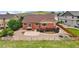 Aerial view of a home with a well-maintained backyard and a charming wooden fence at 1100 Columbine Way, Erie, CO 80516