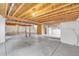Unfinished basement with concrete floor, exposed wood ceiling, and visible utilities ready for your creative ideas at 1100 Columbine Way, Erie, CO 80516